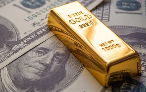 gold-bars-on-top-of-us-bills